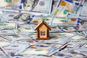 A dollars in bundles on a white background real estate sale houses concept business in a pandemic