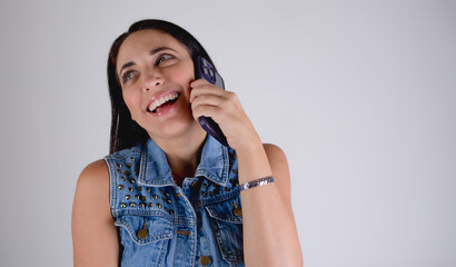 Fototapeta premium woman talking on the phone and making expression 