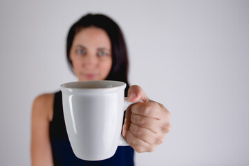 woman holding a coffee tea mug 