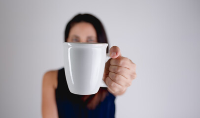woman holding a coffee tea mug 
