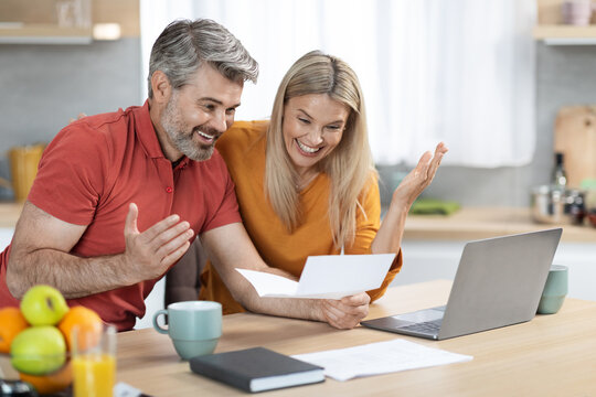 Emotional Spouses Reading Letter From Bank, Celebrating Success