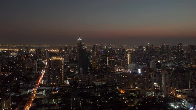 sunset night illumination bangkok cityscape downtown traffic aerial panorama 4k timelapse thailand  