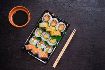 assorted sushi platter, chopsticks and soy sauce