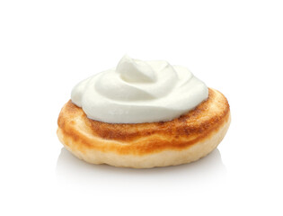 Thick fluffy pancake with sour cream isolated on white background