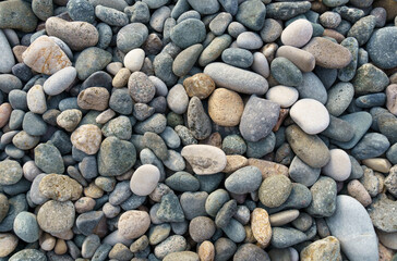 Texture of small sea pebbles. View from above.