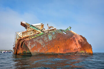 sunken ship, grounded transport ship, rusty skeleton of ship
