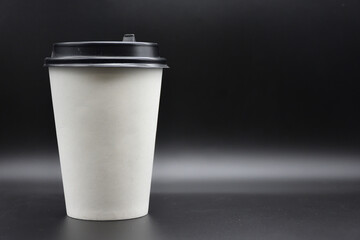 white paper cup for coffee on black background