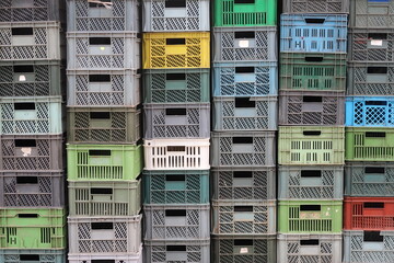 Plastic storage crate boxes stacked in piles