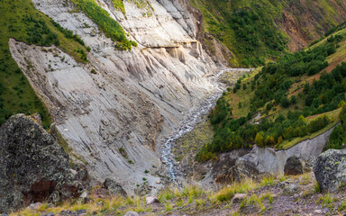 Aerial shot of a gorge with river flows at the bottom of a gorge