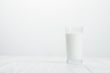 A glass of milk on a white background. Benefits of milk