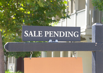 Close up on Sale Pending sign in front of a California Home. Housing crisis, homes for sale..