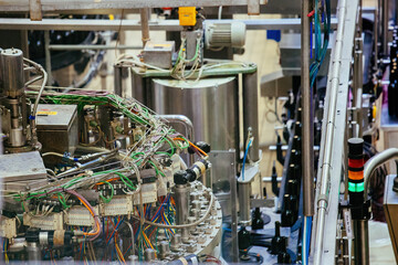 Bottling and sealing wine conveyor production line at modern winery