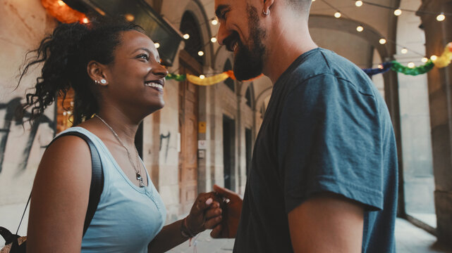 Happy Interracial Couple Dancing Outdoors