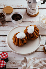 cupcakes with buttercream, coffee on a light wooden background