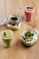granola in a jar with Greek yogurt and wild berries