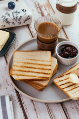 toast bread with butter and jam for breakfast