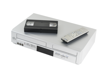 Old video cassette and disk player with tape and remote controller isolated.