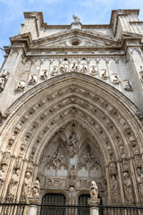 Fototapeta na wymiar A fragment of the Primatial Cathedral of Saint Mary of Toledo (Spanish: Catedral Primada Santa María de Toledo) exterior