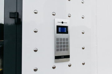 cool modern trendy intercom on the front door in the entrance
