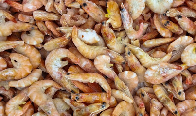 Frozen shrimp. Seafood on the counter. Fish market. Close-up shooting of seafood.