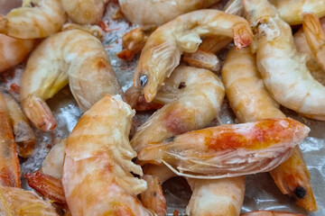 Frozen shrimp. Seafood on the counter. Fish market. Close-up shooting of seafood.