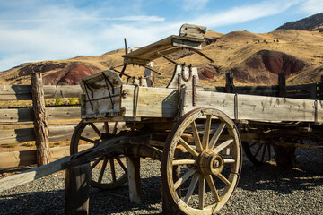Fototapeta na wymiar An old historic freight wagon on a historic sheep and cattle ranch on the John Day river that is now part of the John Day Fossil Beds National Monument, located in Wheeler County, Oregon,