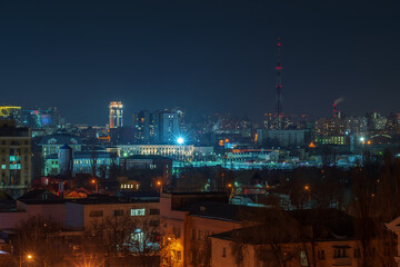 Obraz na płótnie Canvas View at night city buildings with illumination.