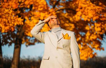 person in the autumn park. Business concept. Male. Autumn background. Nature. 