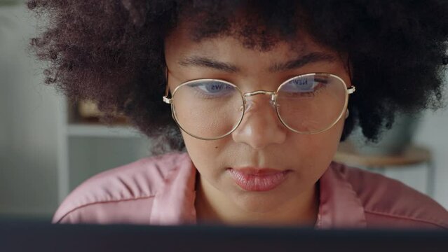 Laptop business, reading email and woman writing a proposal on the internet, thinking of idea for company and working on the web in office. Face of African receptionist typing online on computer