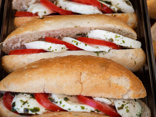 Delicious filled German mini baguette with mozzarella and tomatoes
