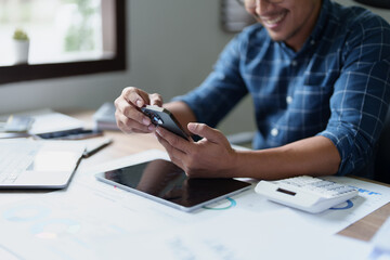 Portrait of a male business owner using a mobile phone