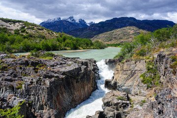Chile, Aysen. Waterfall on Rio Tranquilo below the San Lorenzo Mountain massif.