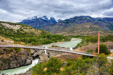 Chile, Aysen. Bridge crossing Rio Tranquilo below the San Lorenzo mountain massif.