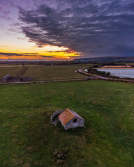 Sunset over a barn