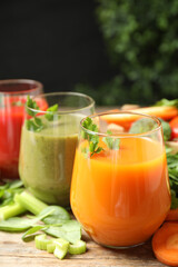 Delicious vegetable juices and fresh ingredients on wooden table
