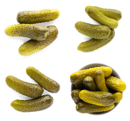 Set with tasty pickled cucumbers on white background, top view