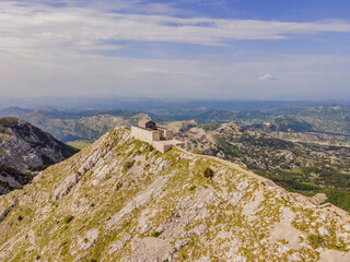 Montenegro. Lovcen National Park. Mausoleum of Negosh on Mount Lovcen. Drone. Aerial view. Viewpoint. Popular tourist attraction. Petar II Petrovic-Njegos mausoleum on the top of mount Lovchen in