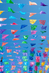 Colorful pennants on lines.