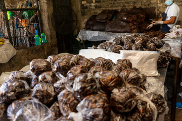 Tamarind balls packed in plastic bags in an artisanal processing plant