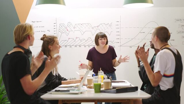 Marketing team, high five and success presentation in workshop, sales training or teamwork in KPI company growth analytics. Diversity, happy or smile creative team with partnership or b2b sales deal