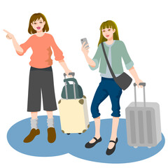 スーツケースを持って移動する旅行中の若い女性2人組、1人はスマートフォンで何かを調べており、もう1人は前方を指差している