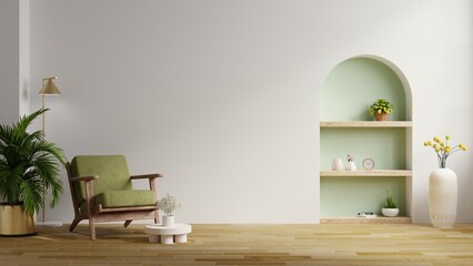 Living room has a green armchair and decoration on empty white color wall.