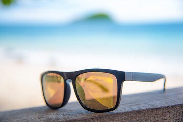 Fototapeta na wymiar wooden glasses on the beach on holiday
