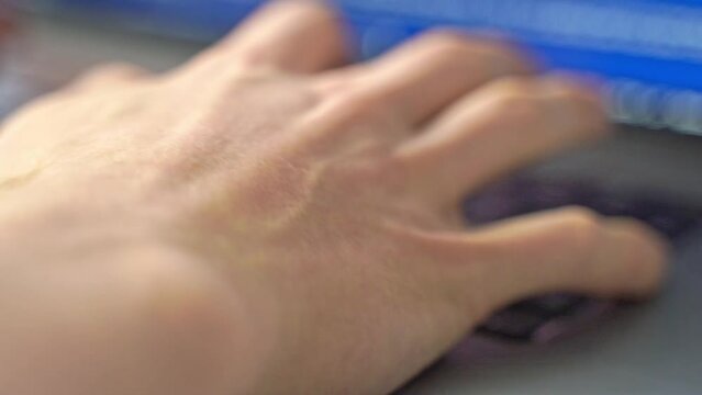 focus on the hands as they type on a keyboard in a professional setting