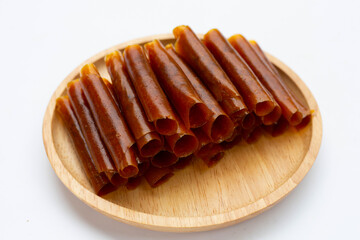 Dried mango paste sheets on white background.