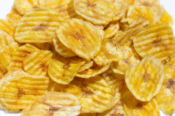 Banana slice chips on white background.