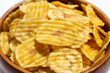 Banana slice chips in wooden bowl