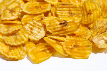 Banana slice chips on white background.