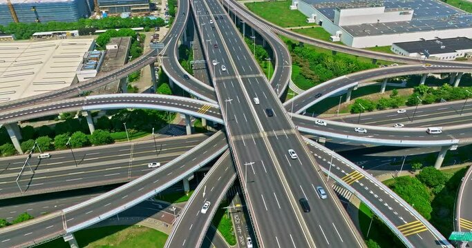 Aerial footage of urban expressway overpass. multi storey highway overpass. busy city traffic. Drone surround shooting.
