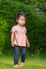 toddler girl in field